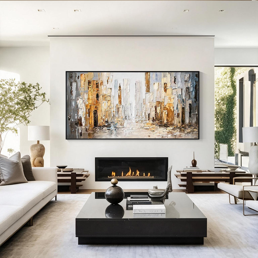 Abstract cityscape wall art with black frame displayed above a fireplace in a modern living room