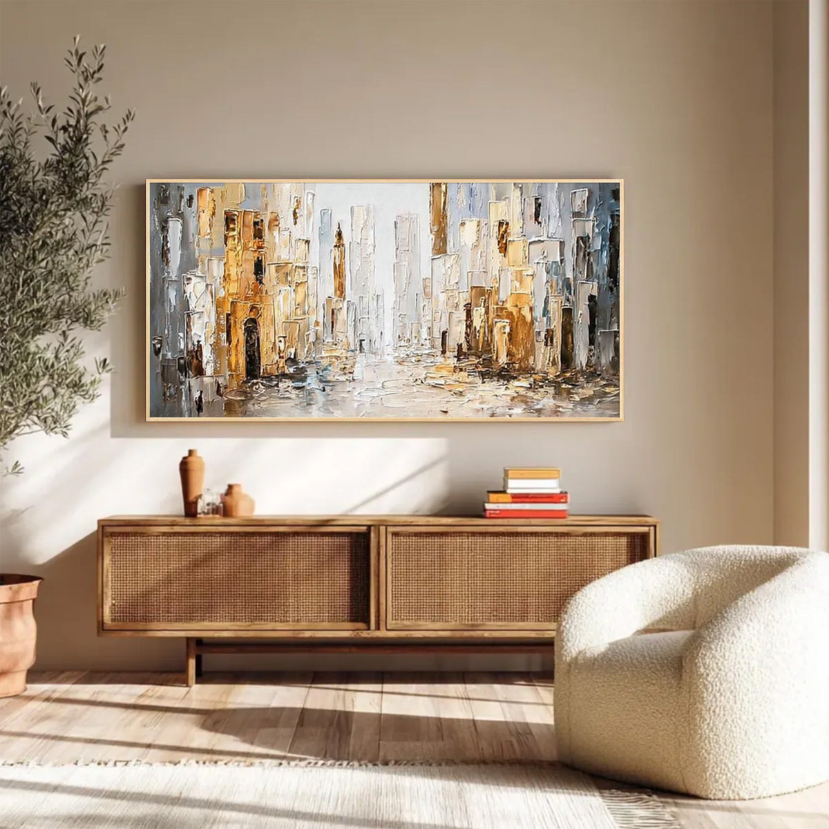 Abstract cityscape wall art with gold frame displayed above a wooden console in a modern living room
