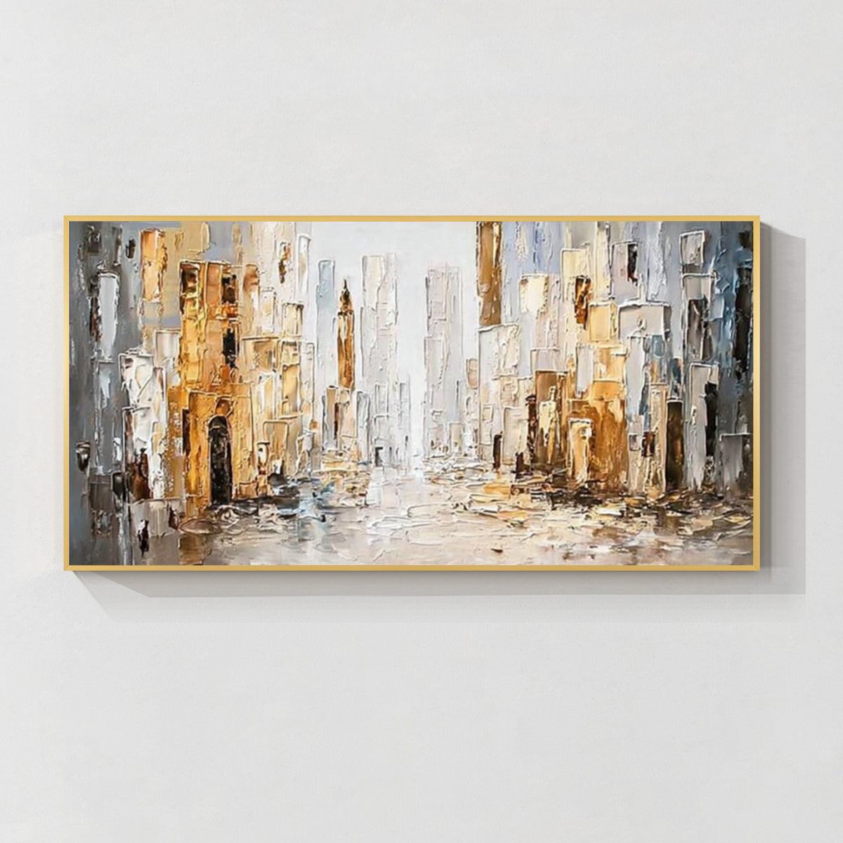 Abstract cityscape wall art with gold frame featuring textured buildings in white, gray and gold