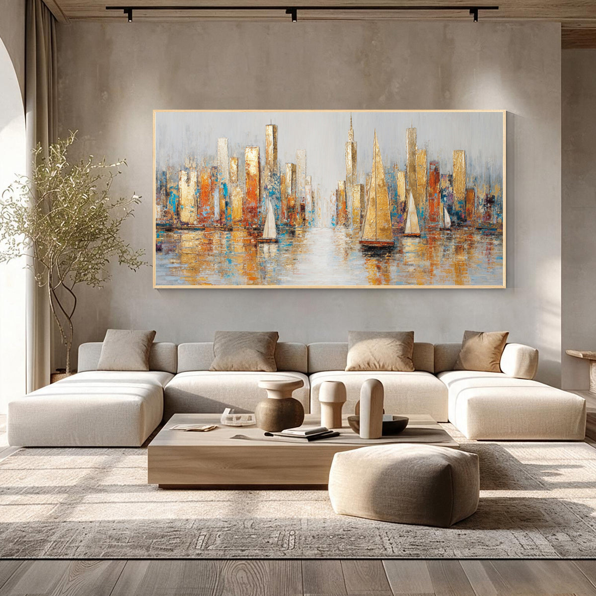 Abstract cityscape and sailboat wall art with gold frame displayed above a sofa in a modern living room