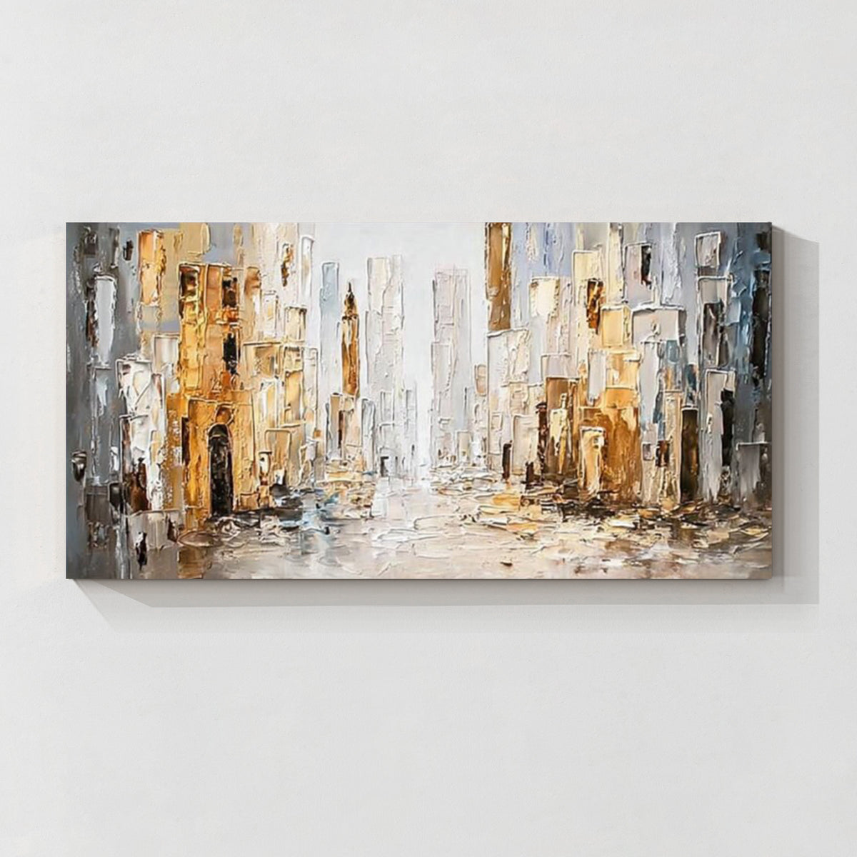 Abstract cityscape wall art featuring textured buildings in white, gray and gold tones
