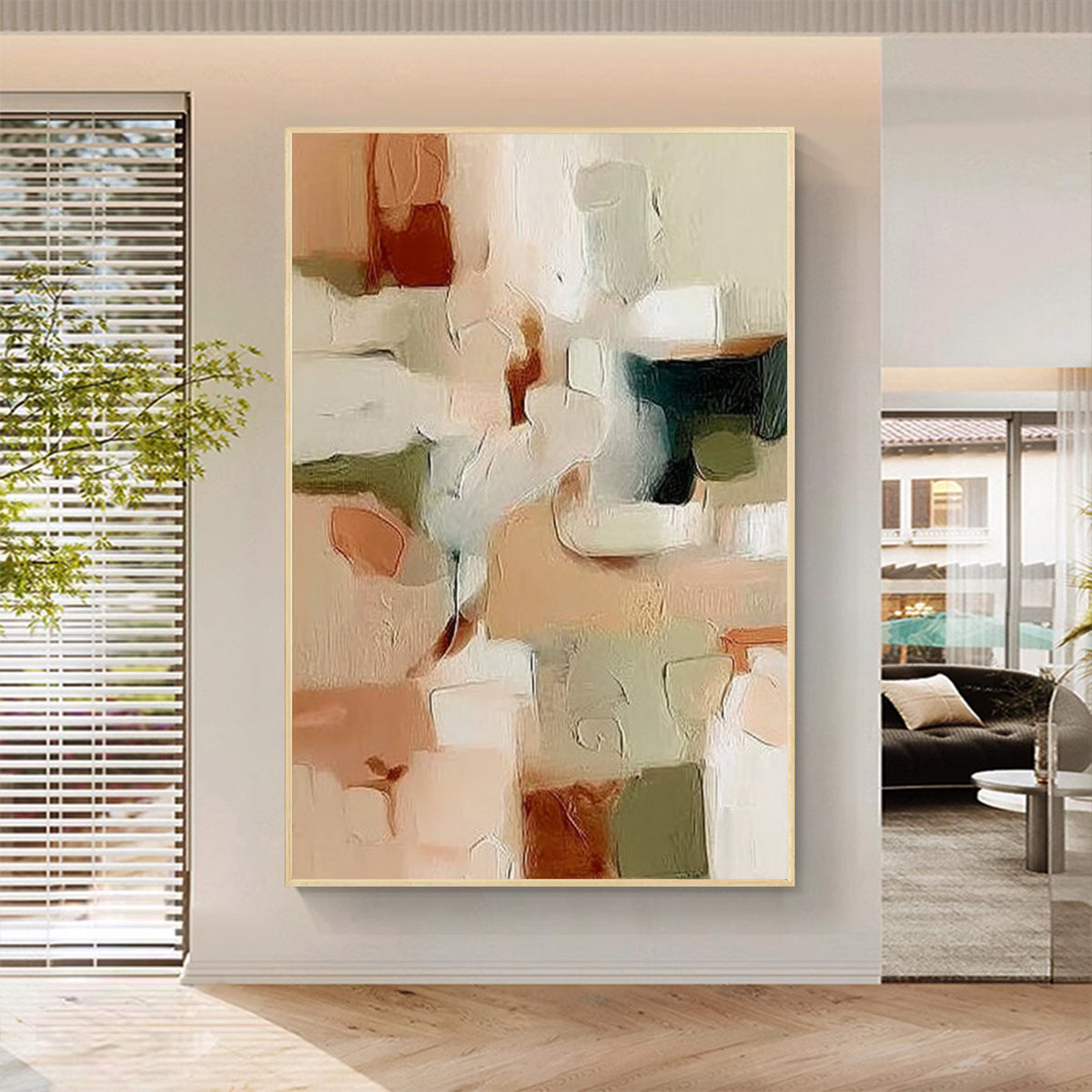 Modern abstract textured wall art with gold and beige tones in a minimalist living room
