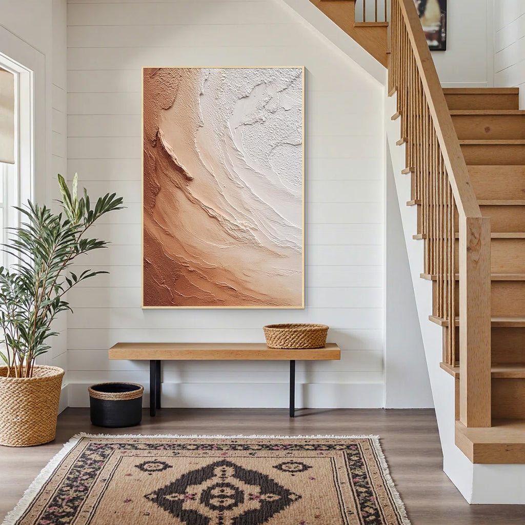 Beige and brown textured abstract wall art with gold frame displayed in a modern entryway, featuring layered organic patterns and minimalist contemporary home decor