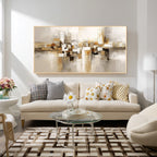 Beige and gold textured abstract canvas wall art with gold frame displayed in a modern living room, elegant horizontal painting with neutral tones for contemporary home decor