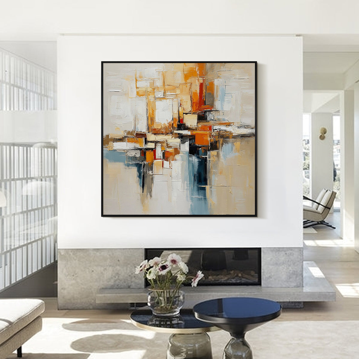 Beige orange and blue textured abstract wall art with black frame displayed above a fireplace in a modern living room, featuring layered brush strokes and contemporary decor