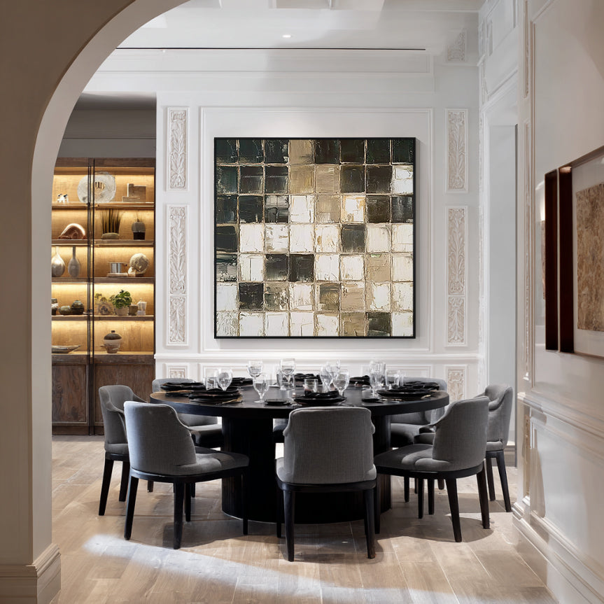 Black and beige abstract wall art with black frame, textured geometric painting displayed in a modern dining room