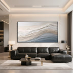 Black frame neutral textured abstract wall art displayed above a modern living room sofa