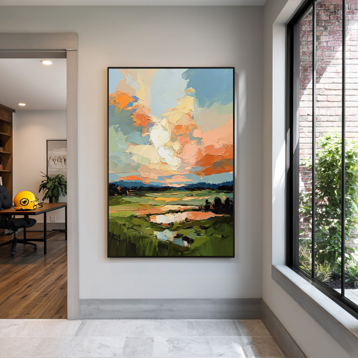 Colorful abstract landscape canvas art with black frame featuring textured oil painting details displayed in a modern interior