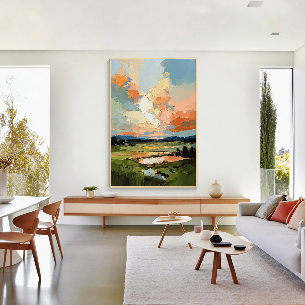 Colorful abstract landscape canvas art with gold frame featuring textured oil painting brush strokes displayed in a modern living room