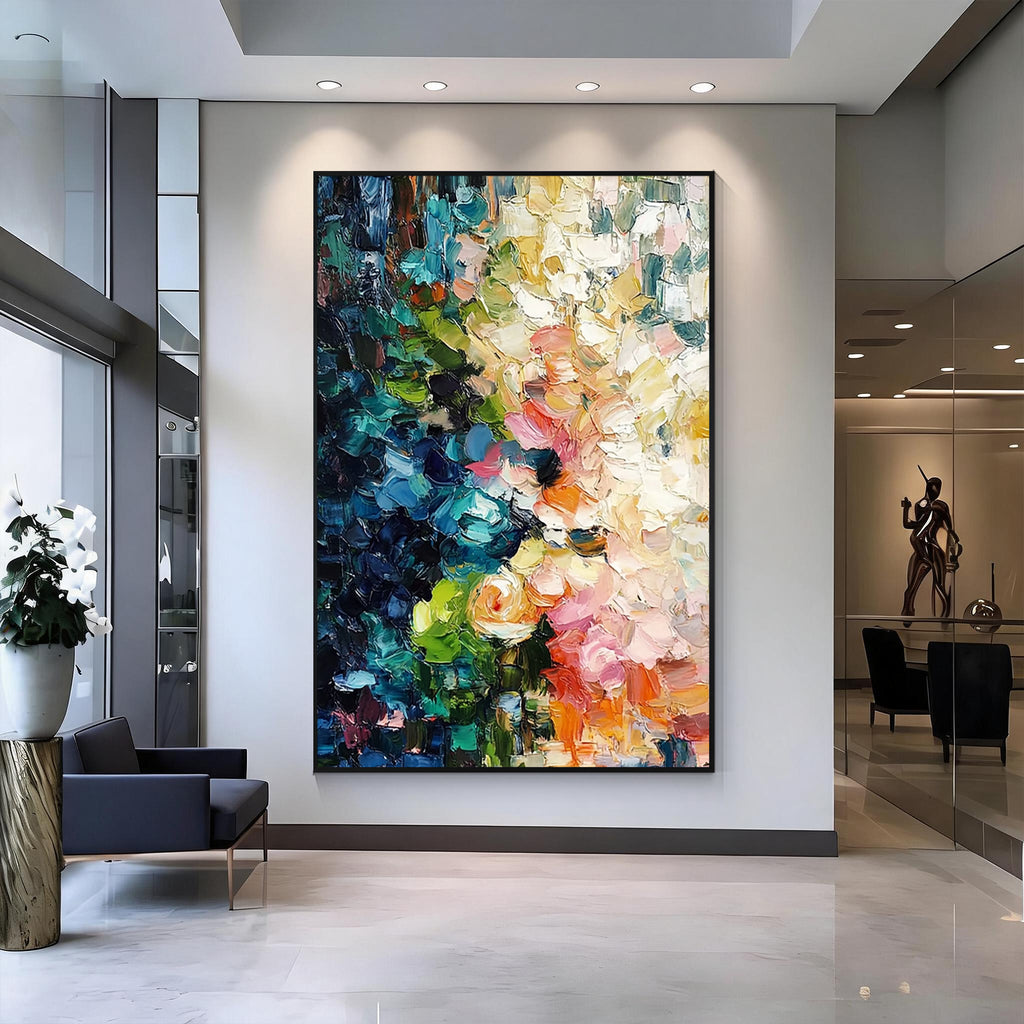 Colorful blue green pink and orange textured abstract wall art with black frame displayed in a modern living room, featuring layered brush strokes and contemporary interior design