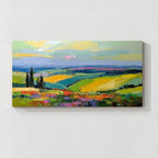 Colorful countryside landscape canvas wall art featuring green fields, yellow hills, blue sky and vibrant textured brushwork
