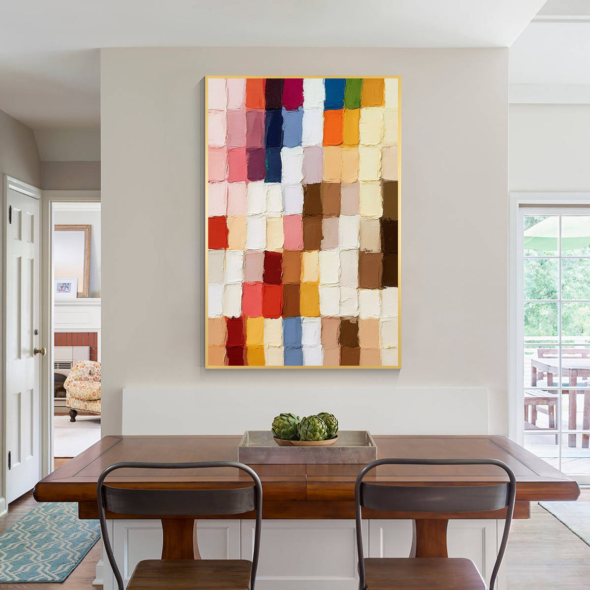 Colorful geometric textured abstract wall art displayed in a modern dining room, featuring multicolor blocks, layered paint texture and contemporary home decor style
