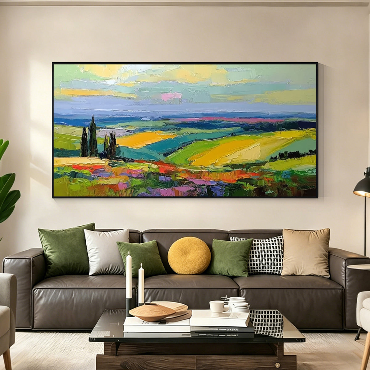 Colorful landscape wall art with black frame displayed above a sofa in a modern living room