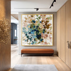 Colorful textured abstract wall art displayed in a modern entryway interior