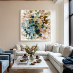 Colorful textured abstract wall art displayed above a sofa in a modern living room interior