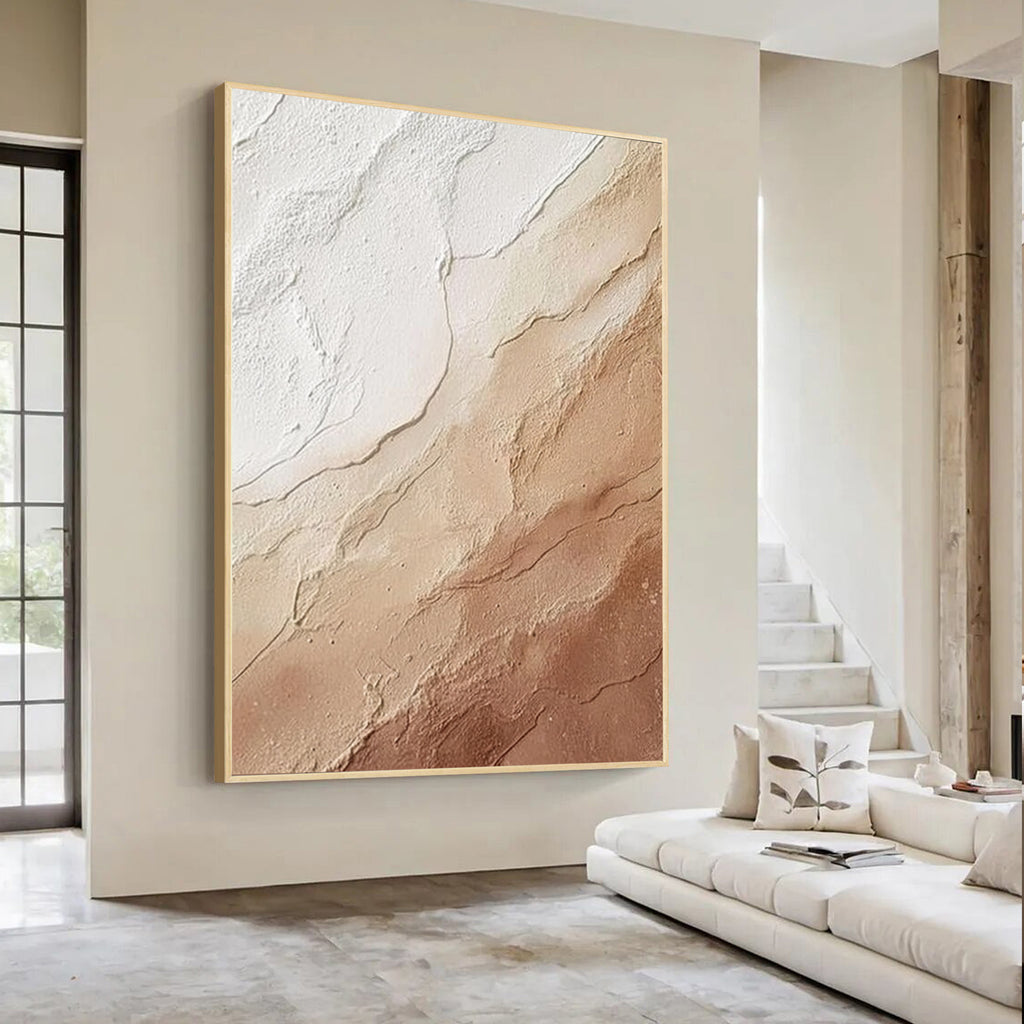 Cream beige textured abstract wall art with gold frame, minimalist plaster texture painting displayed in a modern luxury interior