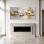 Cream and beige relief textured abstract wall art with gold frame above a modern fireplace