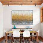 Gold textured abstract wall art displayed in a modern dining room interior
