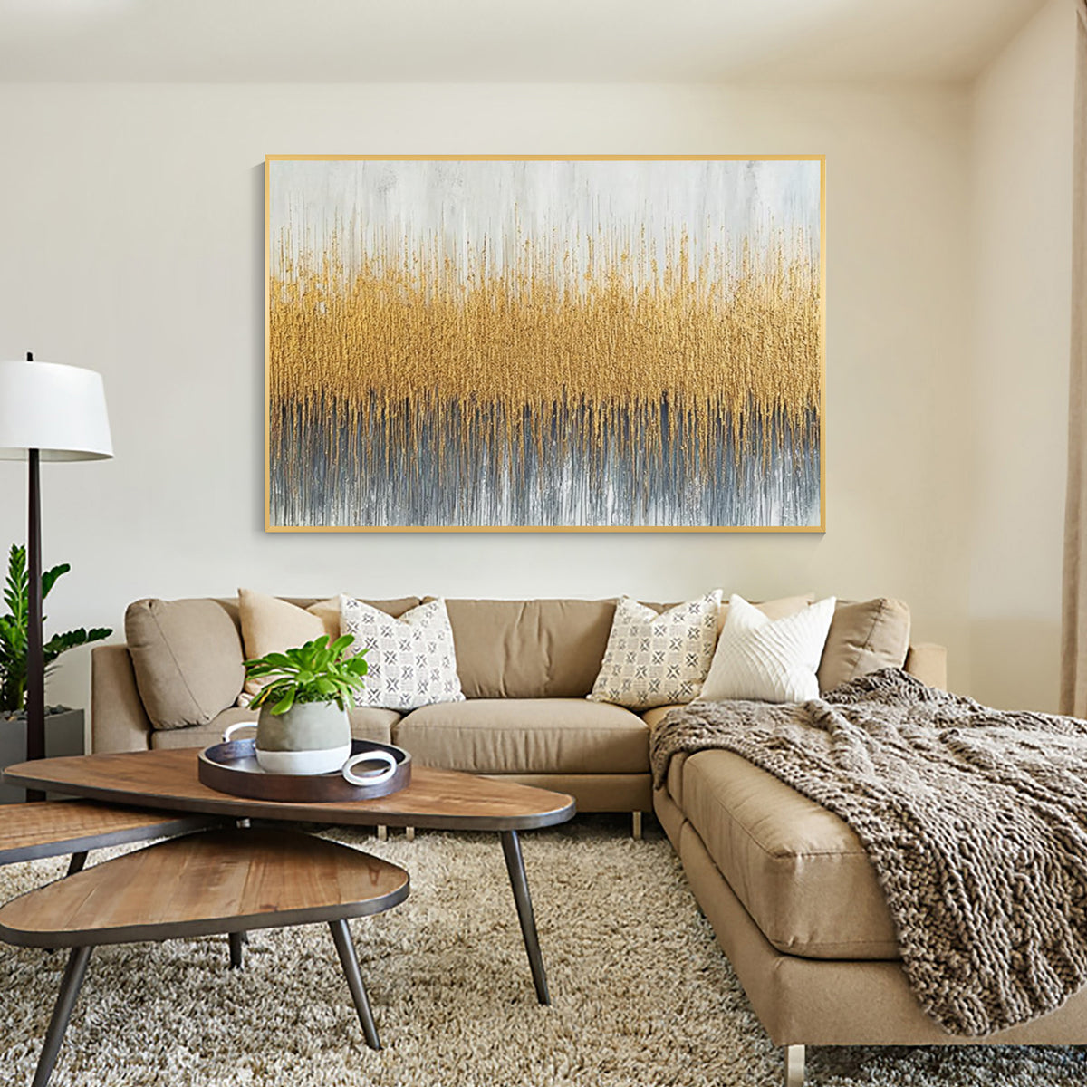 Gold textured abstract wall art displayed above a sofa in a modern living room interior decor