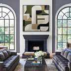Green beige geometric abstract wall art with black frame displayed above a fireplace in a modern living room, minimalist contemporary home decor