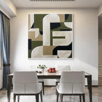 Green beige geometric abstract wall art with white frame displayed in a modern dining room, minimalist contemporary home decor