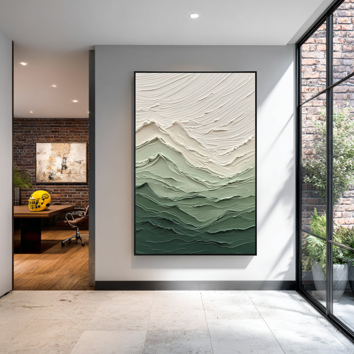 Green gradient textured abstract wall art with black frame displayed in a modern interior