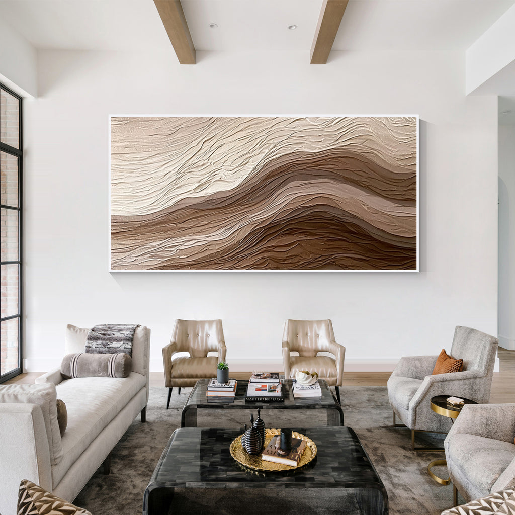 Large 3D textured abstract wall art with beige and brown layered relief design displayed in a modern minimalist living room, framed canvas artwork for luxury home decor