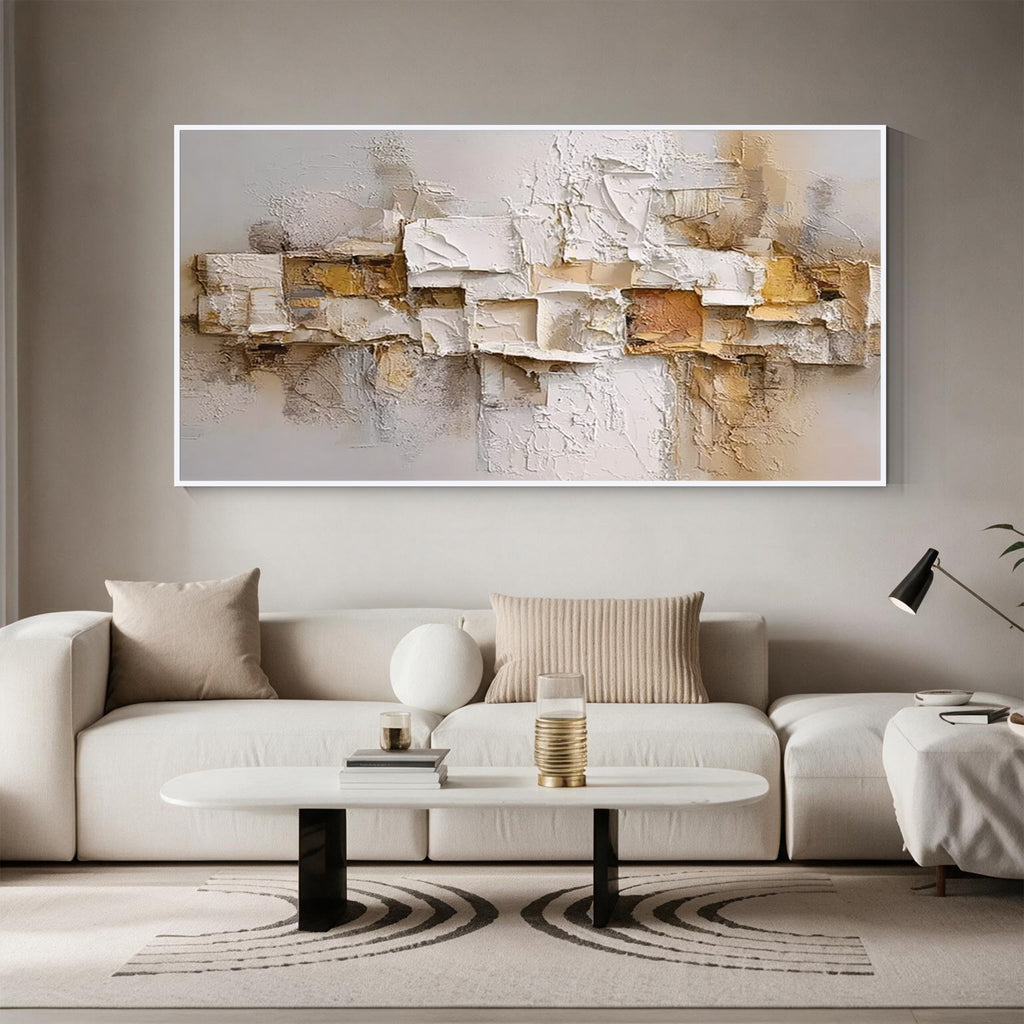 Layered relief textured abstract wall art with white frame above a modern sofa in a neutral living room