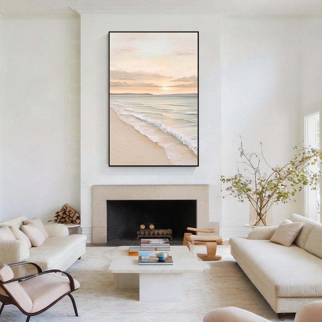 Minimal coastal ocean painting with black frame displayed above a fireplace in a modern living room interior