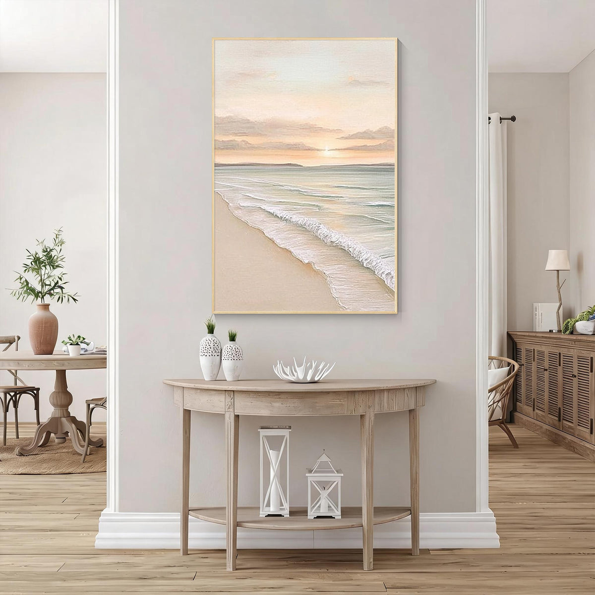 Minimal coastal ocean painting with gold frame displayed in a bright modern entryway interior