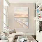 Minimal coastal ocean painting with white frame displayed in a bright modern living room interior