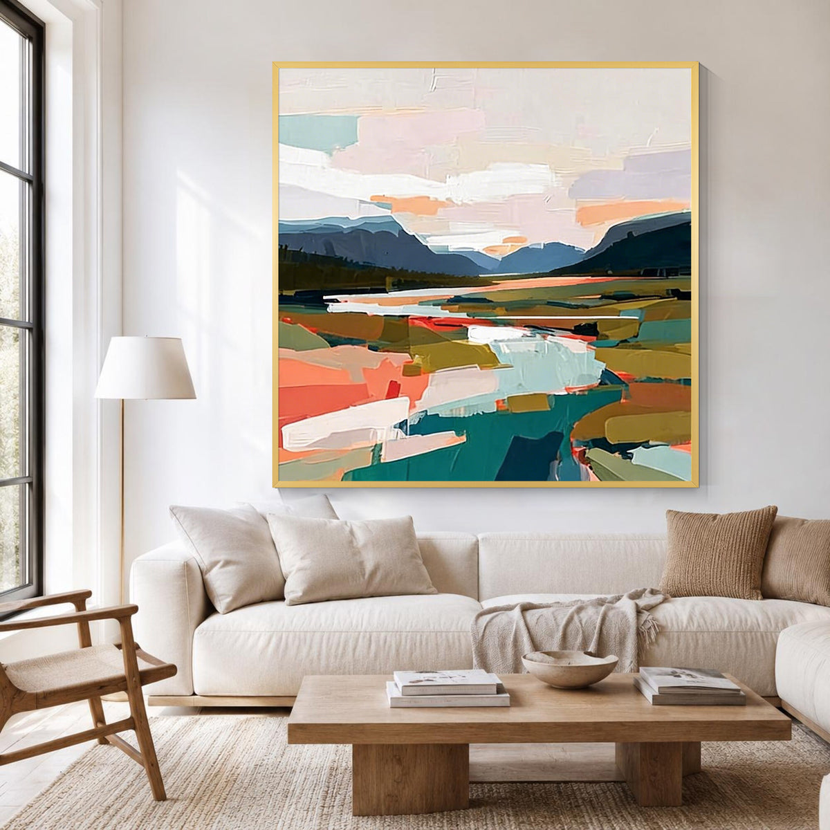 Modern abstract landscape wall art displayed in a contemporary living room with a gold frame
