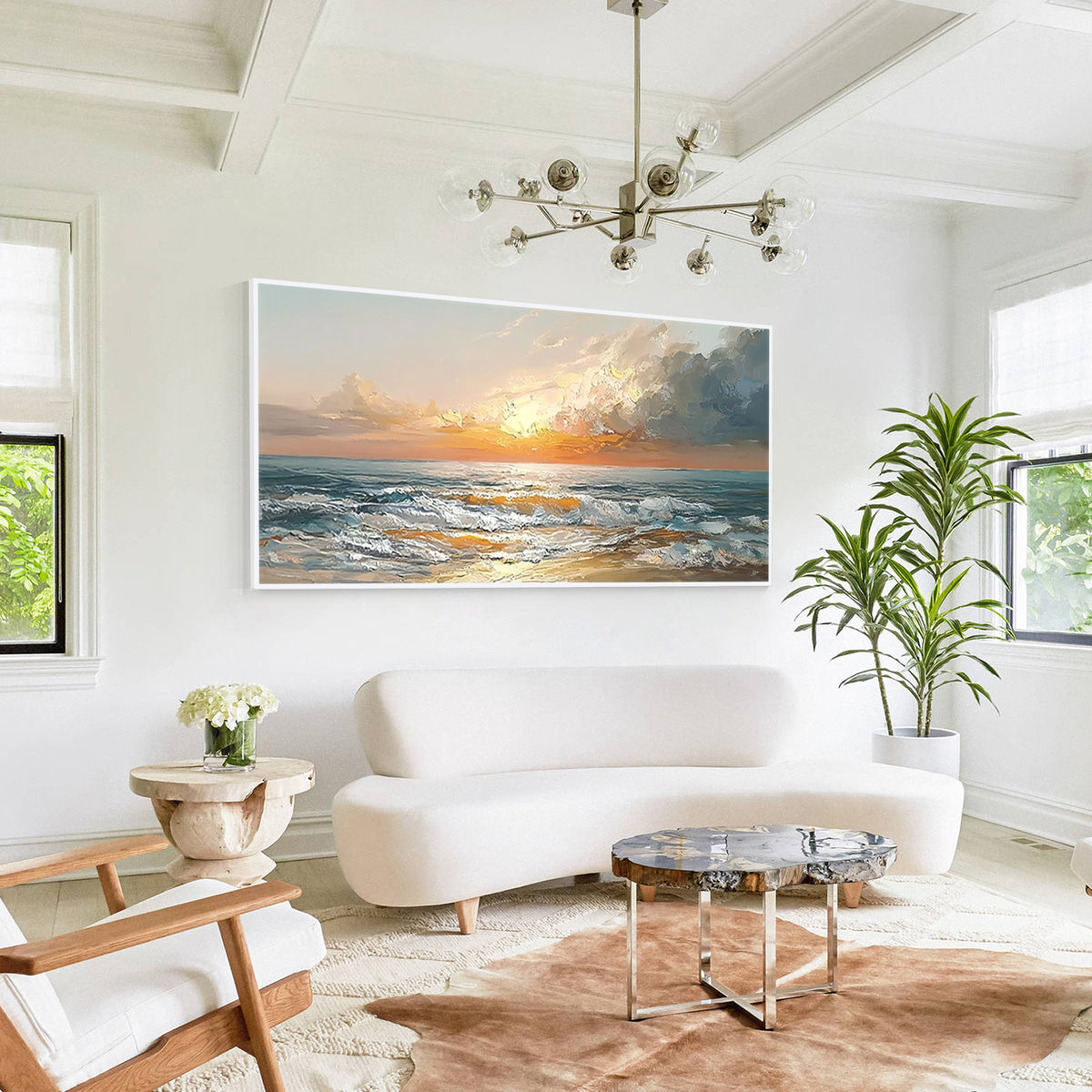 Modern coastal wall art painting displayed above a sofa in a bright living room interior with ocean landscape design