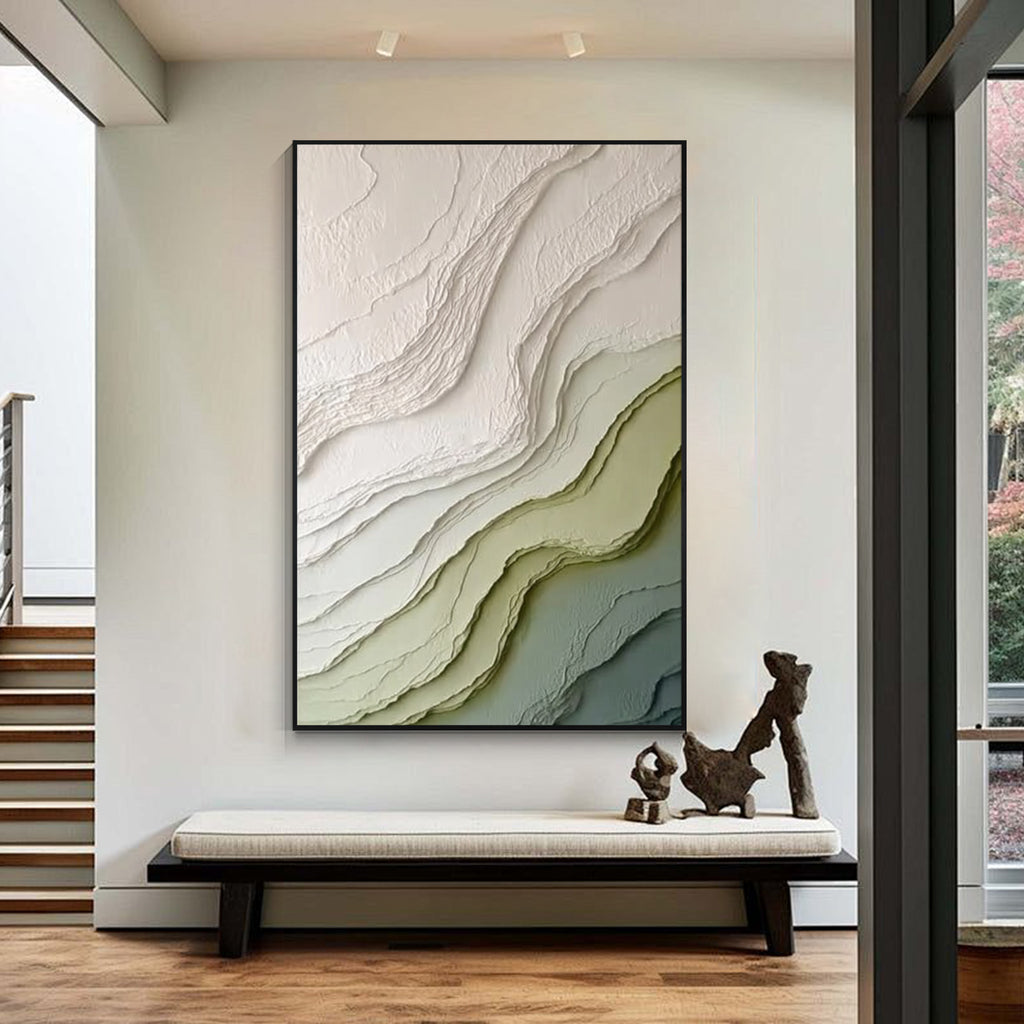 Modern green and beige textured abstract wall art with black frame featuring layered organic patterns displayed in a contemporary interior