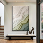 Modern green and beige textured abstract wall art with black frame featuring layered organic patterns displayed in a contemporary interior