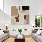 Modern neutral textured abstract wall art displayed above a sofa in a contemporary living room interior