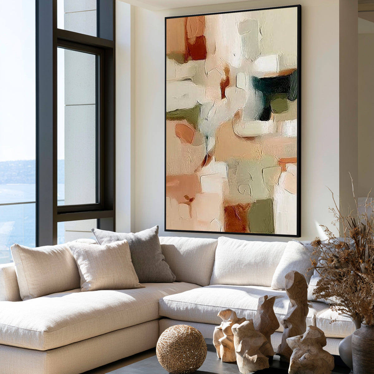 Neutral abstract painting with black frame displayed in a modern living room, beige and green wall art decor