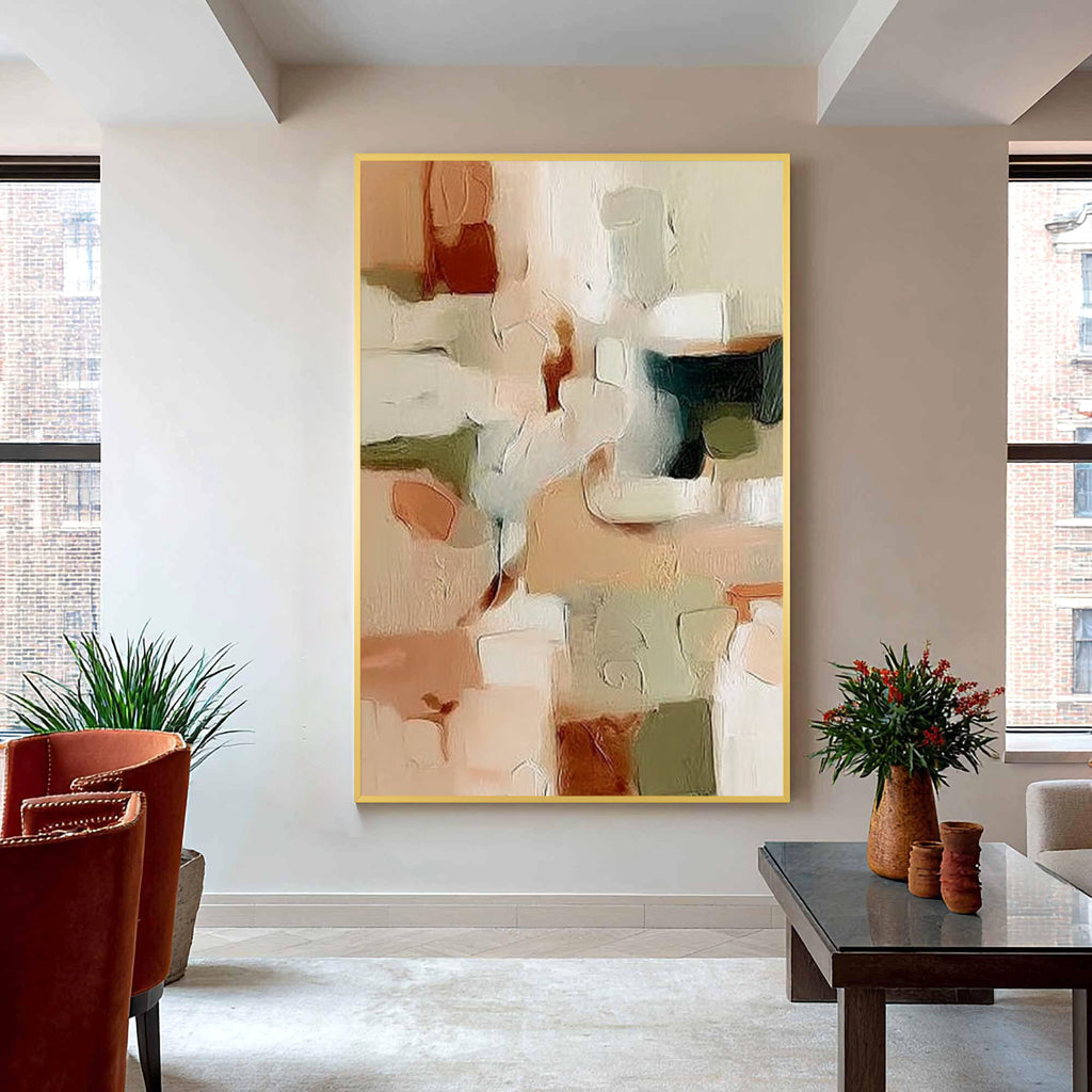 Neutral abstract painting with gold frame displayed in a modern living room, beige green and brown wall art decor