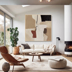 Neutral abstract wall art displayed above a modern living room sofa with minimalist interior decor