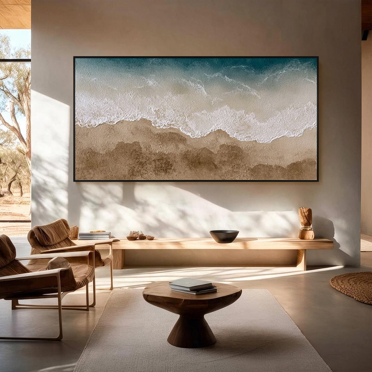 Textured ocean wave and beach wall art with black frame in a modern minimalist entryway