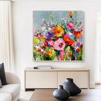 Vibrant floral textured canvas art with gold frame, colorful abstract flower painting displayed in a modern living room interior